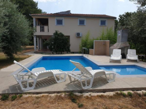 Apartment in holiday home with pool